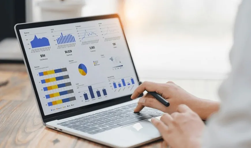 Entrepreneur reviewing financial documents with calculator